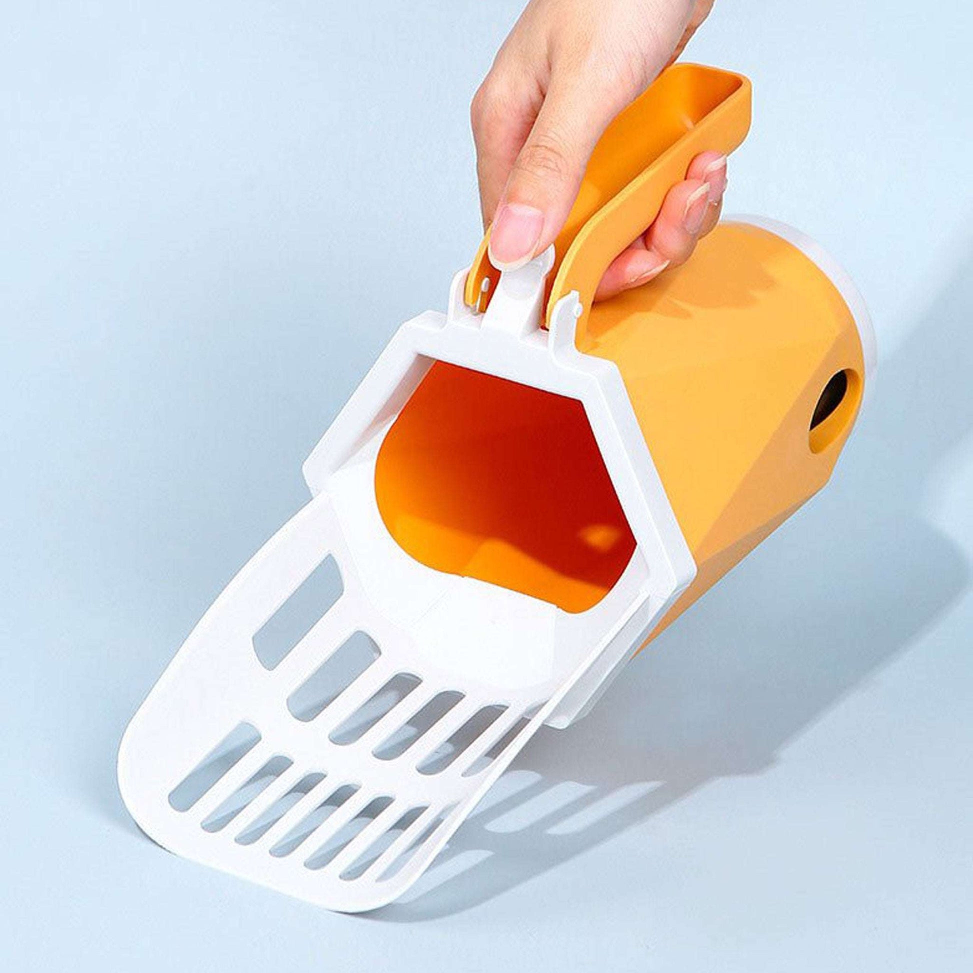 Orange Blufi cat litter box scoop with ergonomic handle for quick daily litter cleaning.