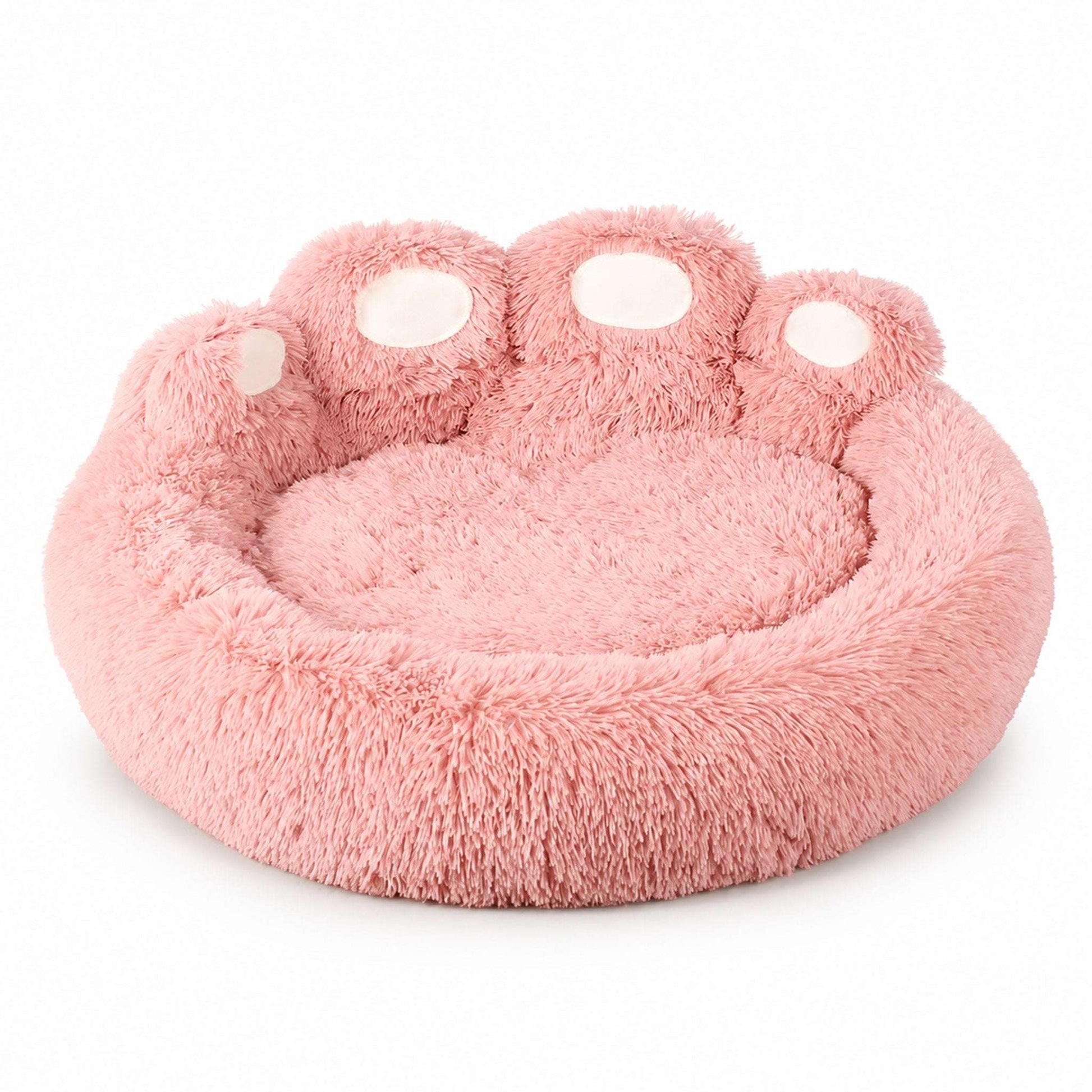 Small pink Blufi bear paw-shaped dog bed with soft plush fabric, designed for pet comfort and cozy rest.